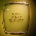 The glass from this door from WNYC's old home in the Municipal Building now decorates the walls of the station's new studios.